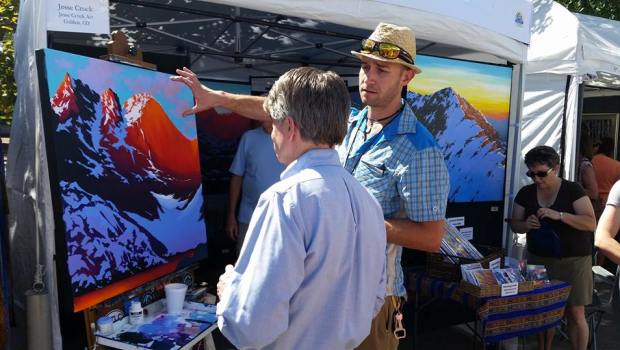Jesse Crock talking with a potential client at the Golden Fine Arts Festival. He's a guest on the March 11, 2015 episode of the Jon of All Trades Podcast.